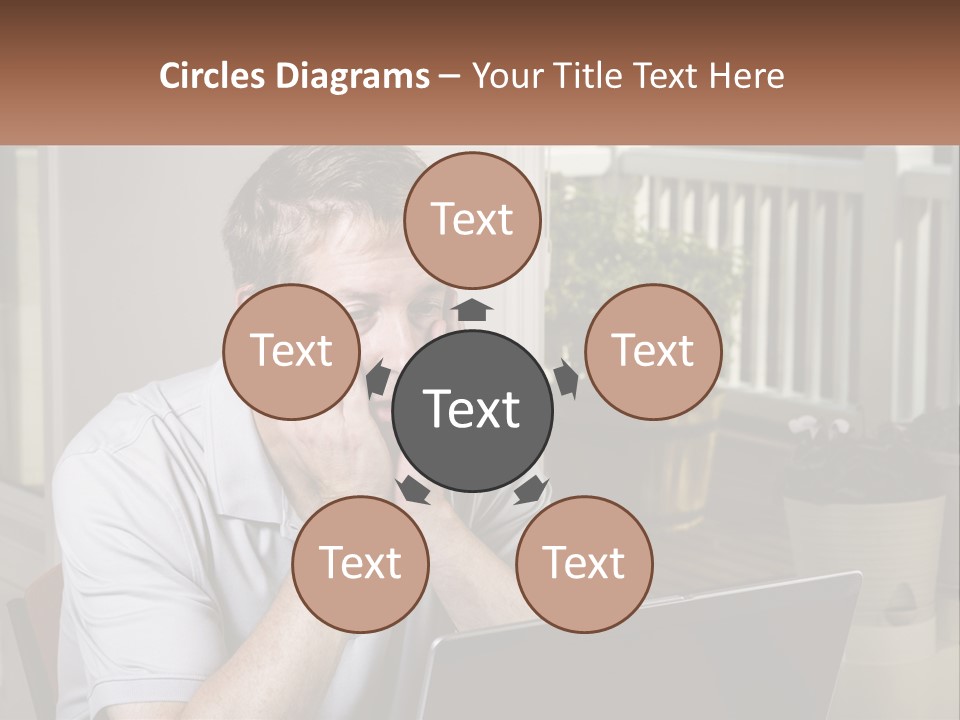 A Man Sitting At A Table With A Laptop In Front Of Him PowerPoint Template