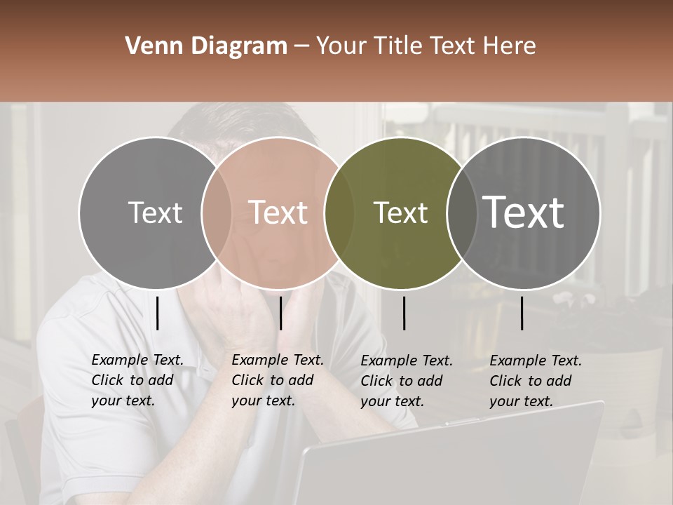 A Man Sitting At A Table With A Laptop In Front Of Him PowerPoint Template