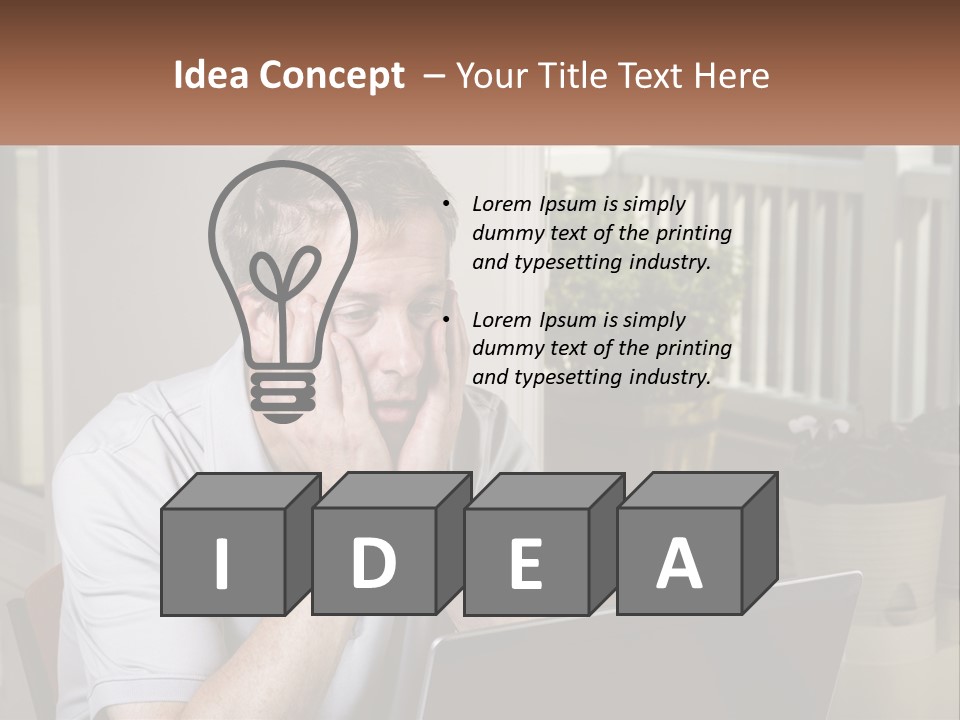 A Man Sitting At A Table With A Laptop In Front Of Him PowerPoint Template