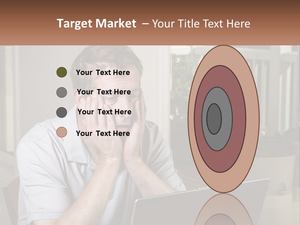 A Man Sitting At A Table With A Laptop In Front Of Him PowerPoint Template