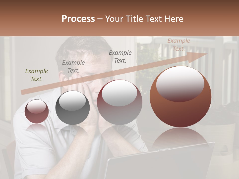 A Man Sitting At A Table With A Laptop In Front Of Him PowerPoint Template