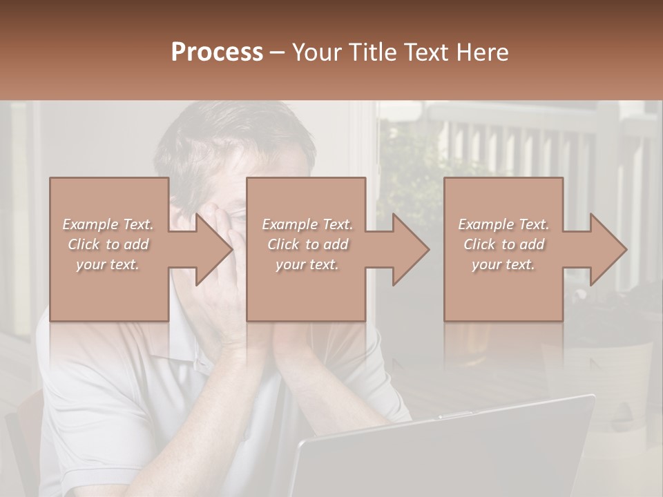 A Man Sitting At A Table With A Laptop In Front Of Him PowerPoint Template