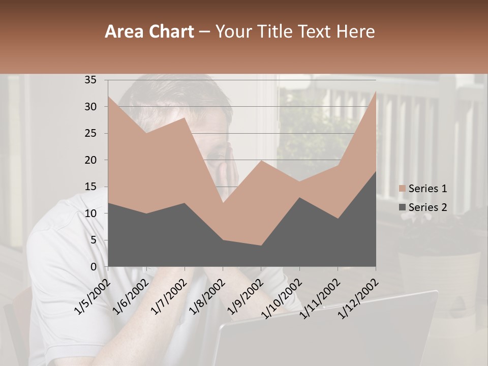 A Man Sitting At A Table With A Laptop In Front Of Him PowerPoint Template