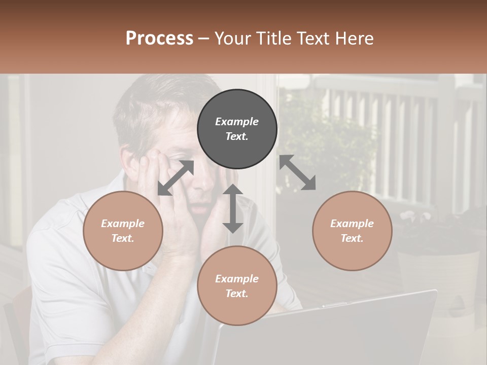 A Man Sitting At A Table With A Laptop In Front Of Him PowerPoint Template