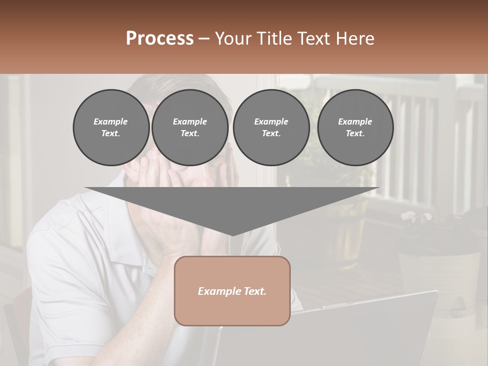 A Man Sitting At A Table With A Laptop In Front Of Him PowerPoint Template