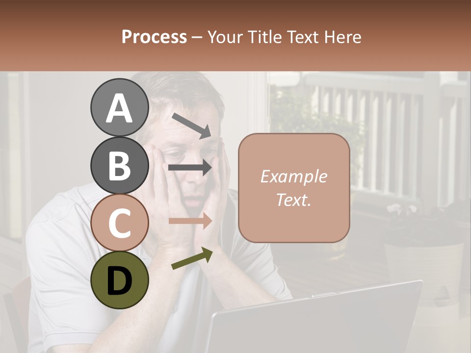 A Man Sitting At A Table With A Laptop In Front Of Him PowerPoint Template