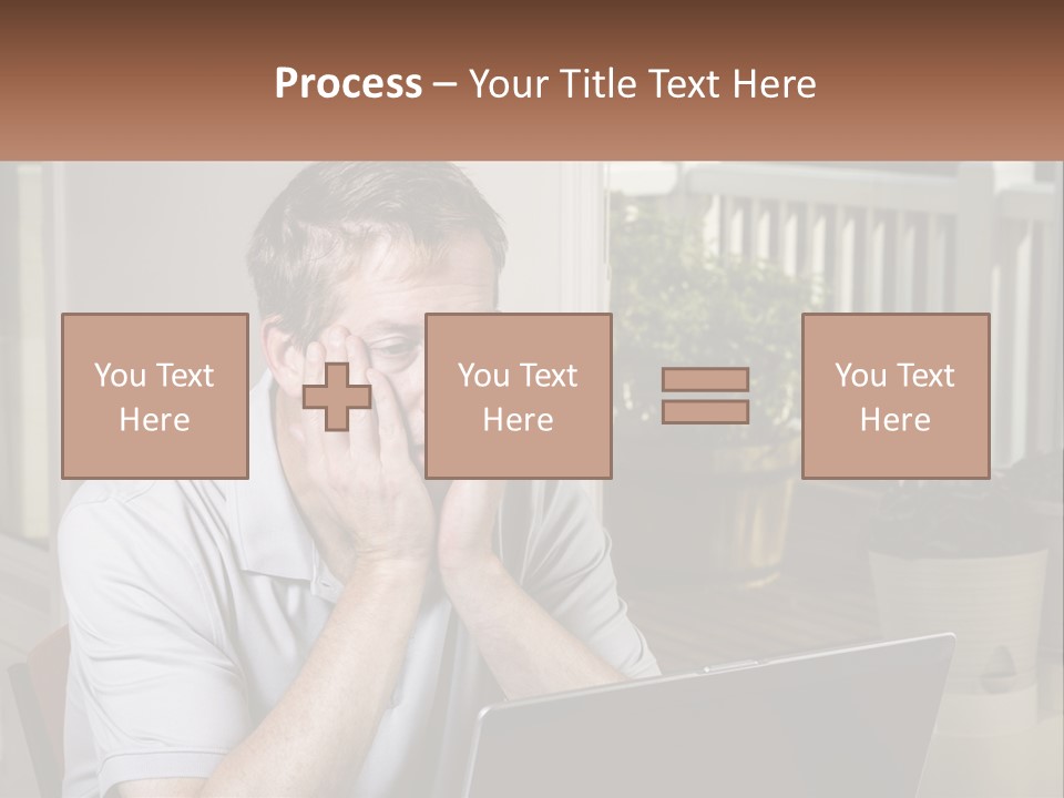 A Man Sitting At A Table With A Laptop In Front Of Him PowerPoint Template