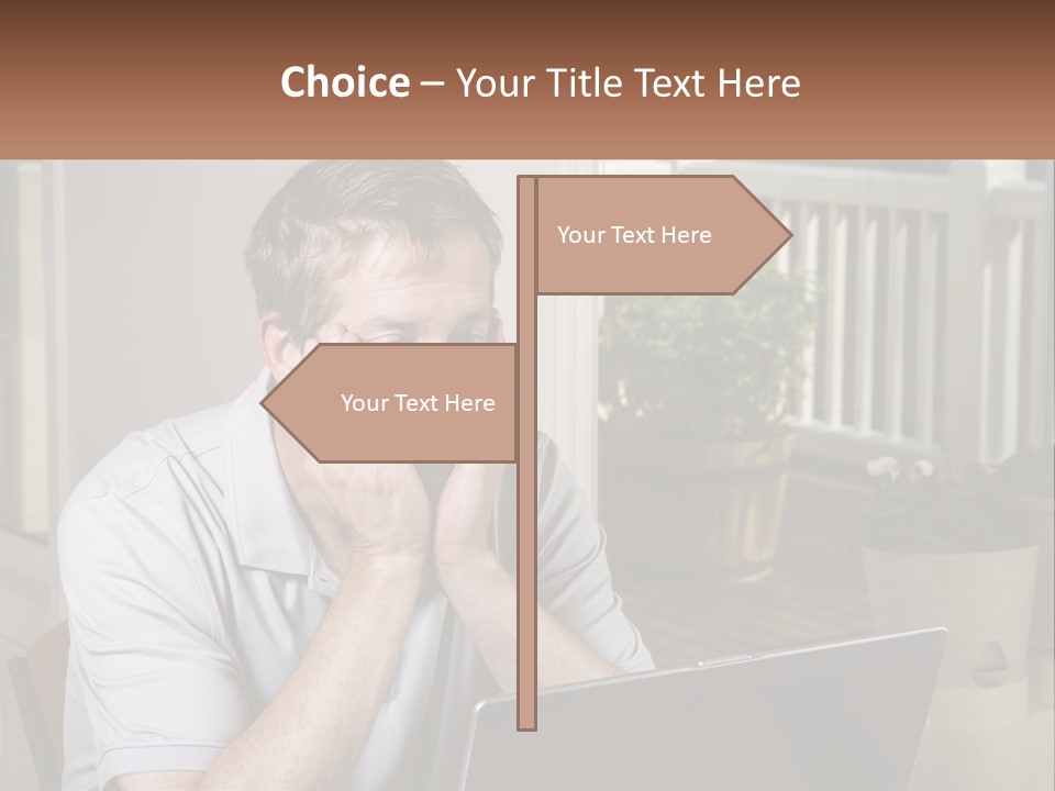 A Man Sitting At A Table With A Laptop In Front Of Him PowerPoint Template