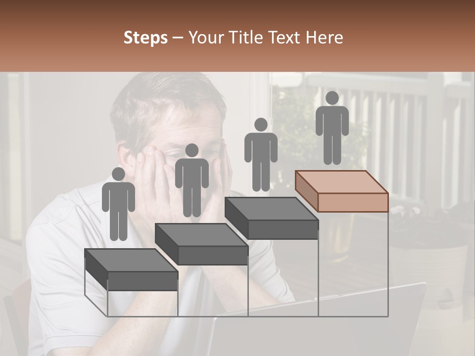 A Man Sitting At A Table With A Laptop In Front Of Him PowerPoint Template