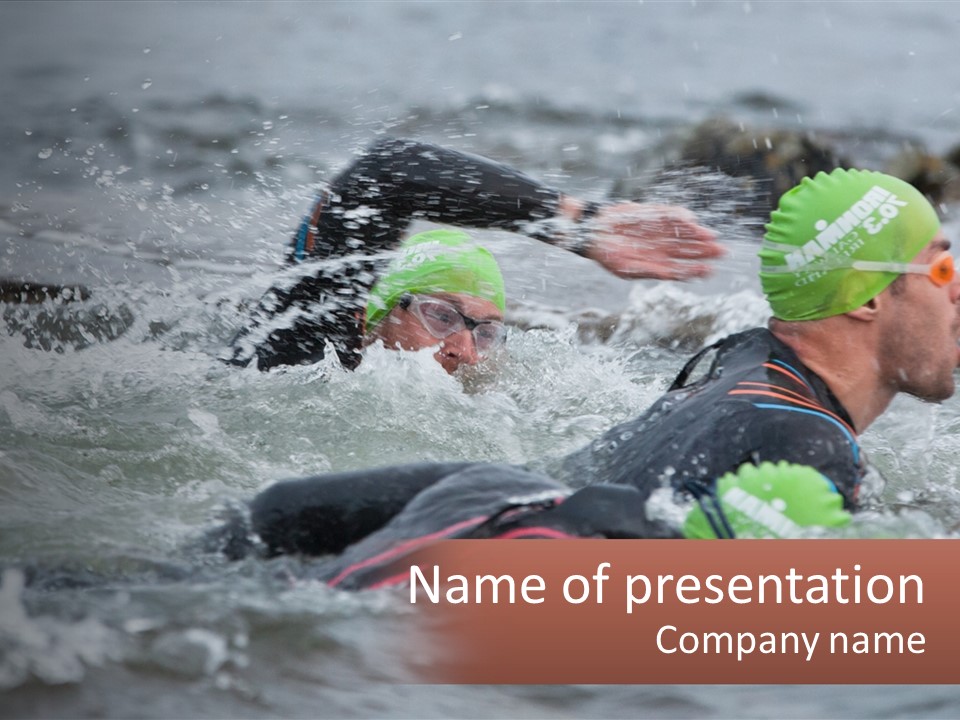 A Couple Of Men Swimming In A Body Of Water PowerPoint Template