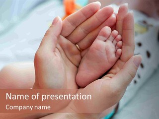 A Person Holding A Baby's Foot In Their Hands PowerPoint Template