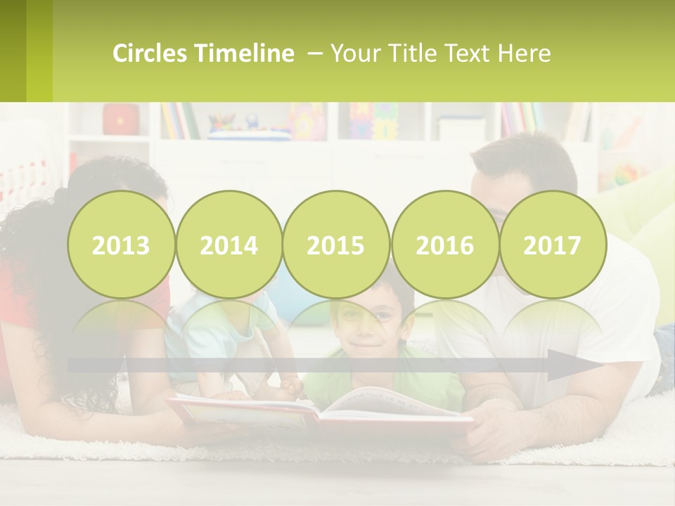 A Family Laying On The Floor With A Book PowerPoint Template