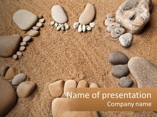 A Group Of Rocks Sitting On Top Of A Sandy Ground PowerPoint Template