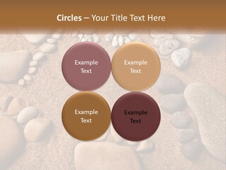 A Group Of Rocks Sitting On Top Of A Sandy Ground PowerPoint Template