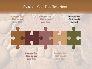 A Group Of Rocks Sitting On Top Of A Sandy Ground PowerPoint Template