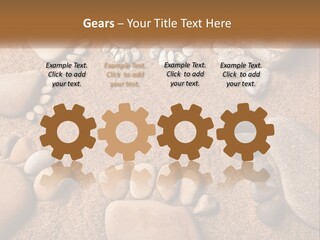 A Group Of Rocks Sitting On Top Of A Sandy Ground PowerPoint Template