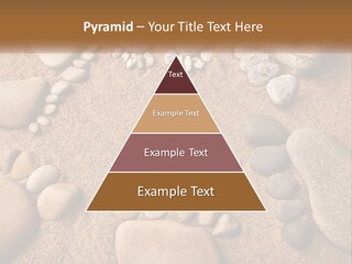 A Group Of Rocks Sitting On Top Of A Sandy Ground PowerPoint Template