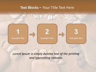 A Group Of Rocks Sitting On Top Of A Sandy Ground PowerPoint Template