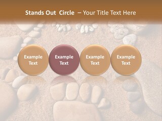 A Group Of Rocks Sitting On Top Of A Sandy Ground PowerPoint Template