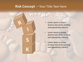 A Group Of Rocks Sitting On Top Of A Sandy Ground PowerPoint Template