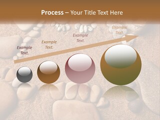 A Group Of Rocks Sitting On Top Of A Sandy Ground PowerPoint Template