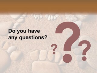 A Group Of Rocks Sitting On Top Of A Sandy Ground PowerPoint Template