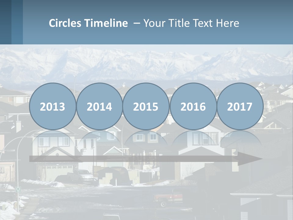 A Large Group Of Houses With Mountains In The Background PowerPoint Template