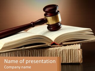 A Judge's Gaven Sitting On Top Of An Open Book PowerPoint Template