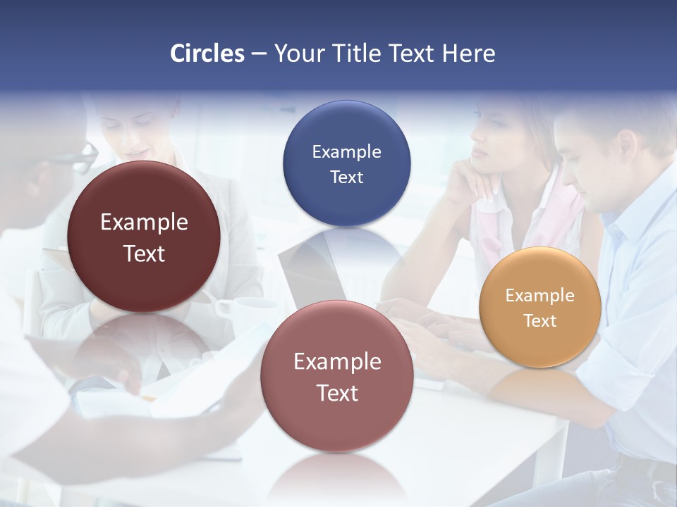 A Group Of People Sitting Around A Table With A Laptop PowerPoint Template