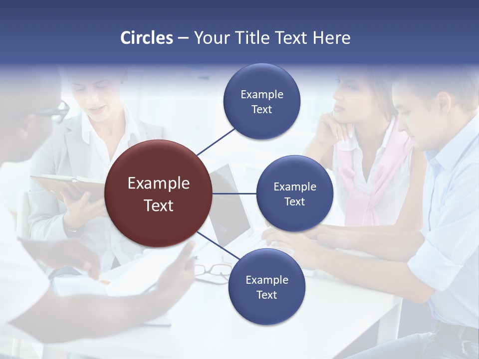 A Group Of People Sitting Around A Table With A Laptop PowerPoint Template