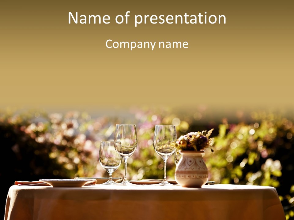 A Table Topped With Two Wine Glasses And A Vase Filled With Flowers PowerPoint Template