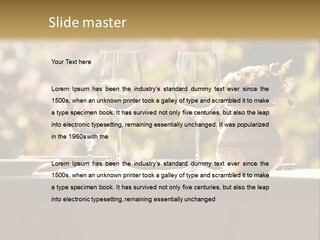 A Table Topped With Two Wine Glasses And A Vase Filled With Flowers PowerPoint Template