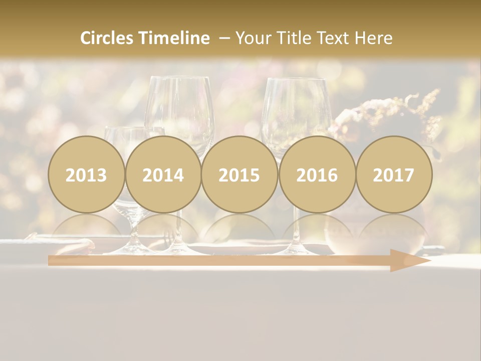 A Table Topped With Two Wine Glasses And A Vase Filled With Flowers PowerPoint Template