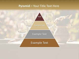 A Table Topped With Two Wine Glasses And A Vase Filled With Flowers PowerPoint Template