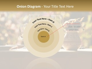 A Table Topped With Two Wine Glasses And A Vase Filled With Flowers PowerPoint Template