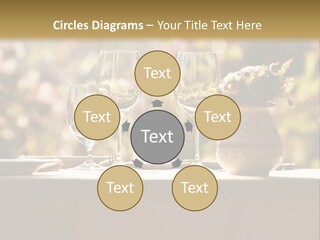 A Table Topped With Two Wine Glasses And A Vase Filled With Flowers PowerPoint Template