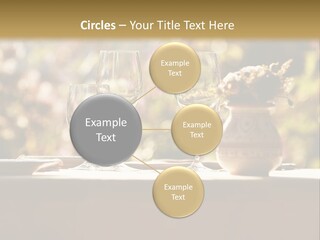 A Table Topped With Two Wine Glasses And A Vase Filled With Flowers PowerPoint Template