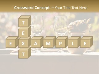 A Table Topped With Two Wine Glasses And A Vase Filled With Flowers PowerPoint Template