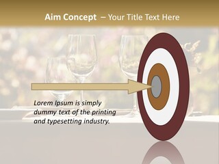 A Table Topped With Two Wine Glasses And A Vase Filled With Flowers PowerPoint Template