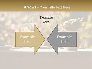 A Table Topped With Two Wine Glasses And A Vase Filled With Flowers PowerPoint Template