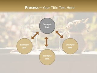 A Table Topped With Two Wine Glasses And A Vase Filled With Flowers PowerPoint Template