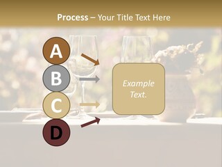 A Table Topped With Two Wine Glasses And A Vase Filled With Flowers PowerPoint Template