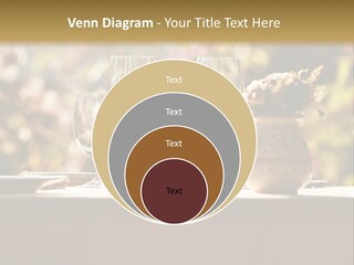 A Table Topped With Two Wine Glasses And A Vase Filled With Flowers PowerPoint Template