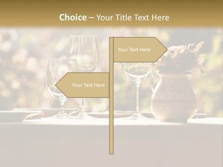 A Table Topped With Two Wine Glasses And A Vase Filled With Flowers PowerPoint Template