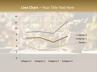 A Table Topped With Two Wine Glasses And A Vase Filled With Flowers PowerPoint Template