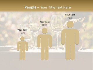 A Table Topped With Two Wine Glasses And A Vase Filled With Flowers PowerPoint Template