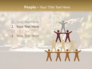 A Table Topped With Two Wine Glasses And A Vase Filled With Flowers PowerPoint Template