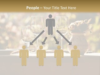 A Table Topped With Two Wine Glasses And A Vase Filled With Flowers PowerPoint Template