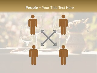 A Table Topped With Two Wine Glasses And A Vase Filled With Flowers PowerPoint Template