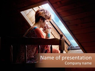 A Woman Sitting On A Bed Looking Out Of A Window PowerPoint Template